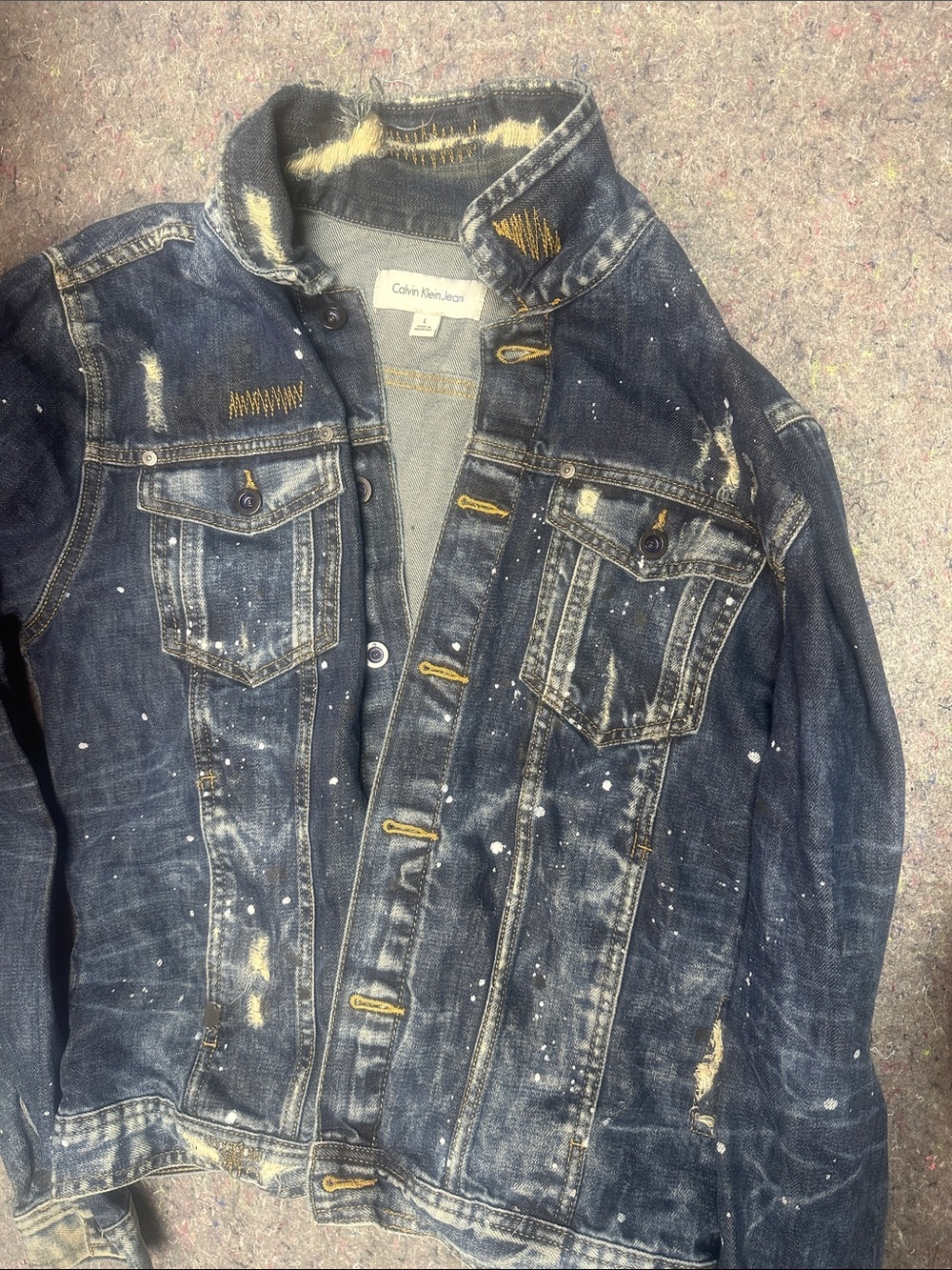 Calvin Klein Men's Dark Blue Distressed Denim Jacket with Yellow Accents